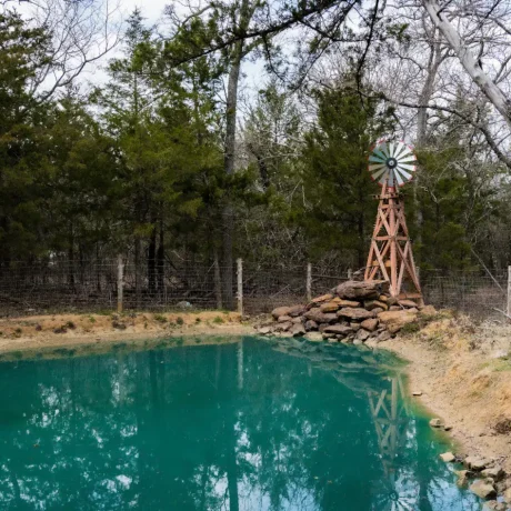 Serene walking trails surrounded by greenery, ideal for peaceful strolls through the resort’s natural beauty at Oak Meadow Ranh RV in Valley View, TX.